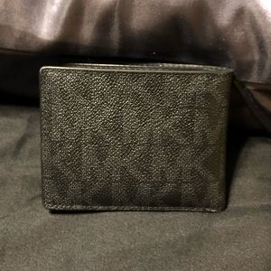 Men’s MK wallet. Minor scuffs, great condition